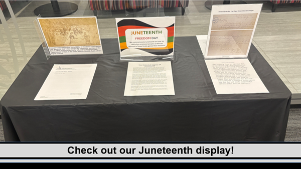 Juneteenth Freedom Day display with Gen. Order No. 3, emancipated slaves picture, and fact sheets