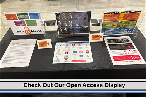 Open Access Week display featuring open education resources and reasons why open access is needed