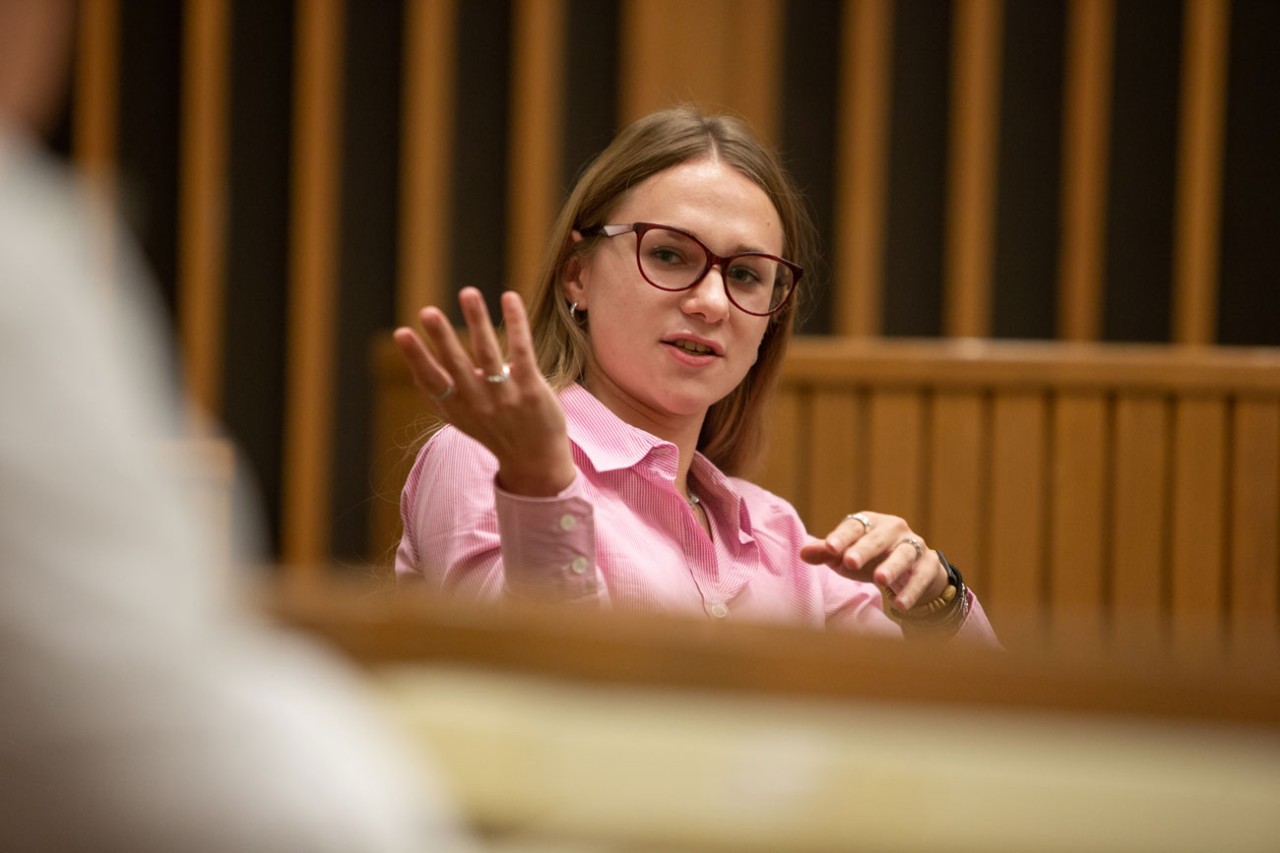 UC Law student participating in a roundtable discussion.